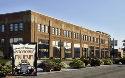 Auburn Cord Duesenberg Automobile Museum Logo and brown brick building