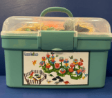dinosaurs fence and flowers in carry case