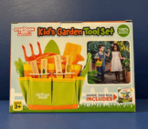 kids garden tool in cady with book