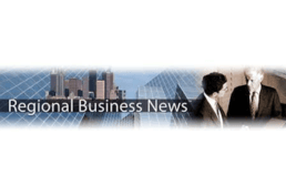 2 men talking beside skyscrapers Regional Business News