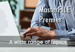 person in front of laptop MasterFILE Premier a wide range of topics