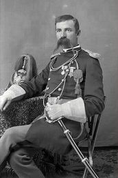 Edward Godfrey sitting in dress uniform with sword