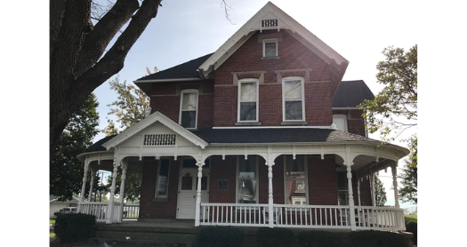 Reb brick house with wrap around porch