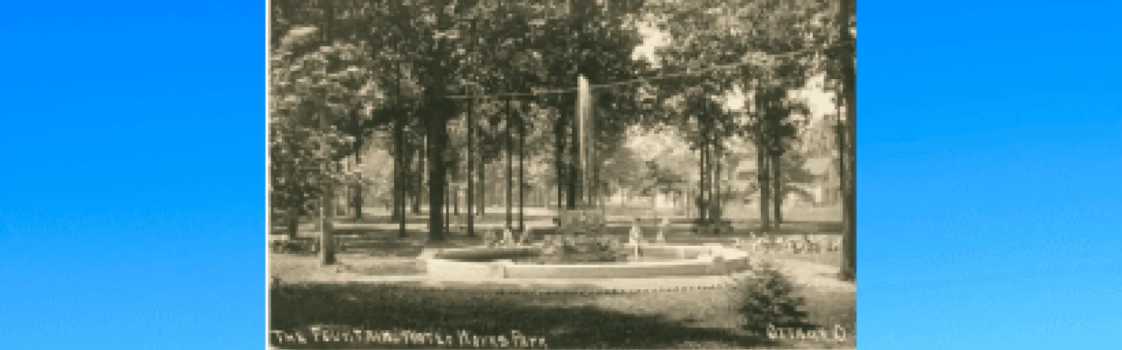children sitting around fountain