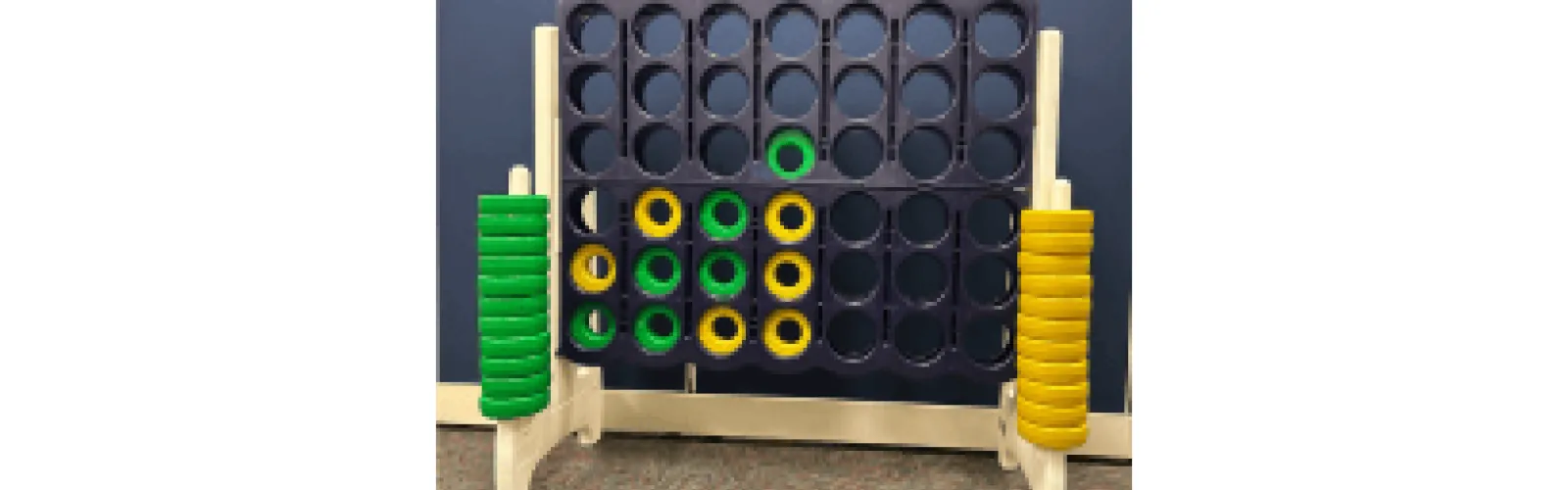 yellow and green discs in oversized 4 in a line game