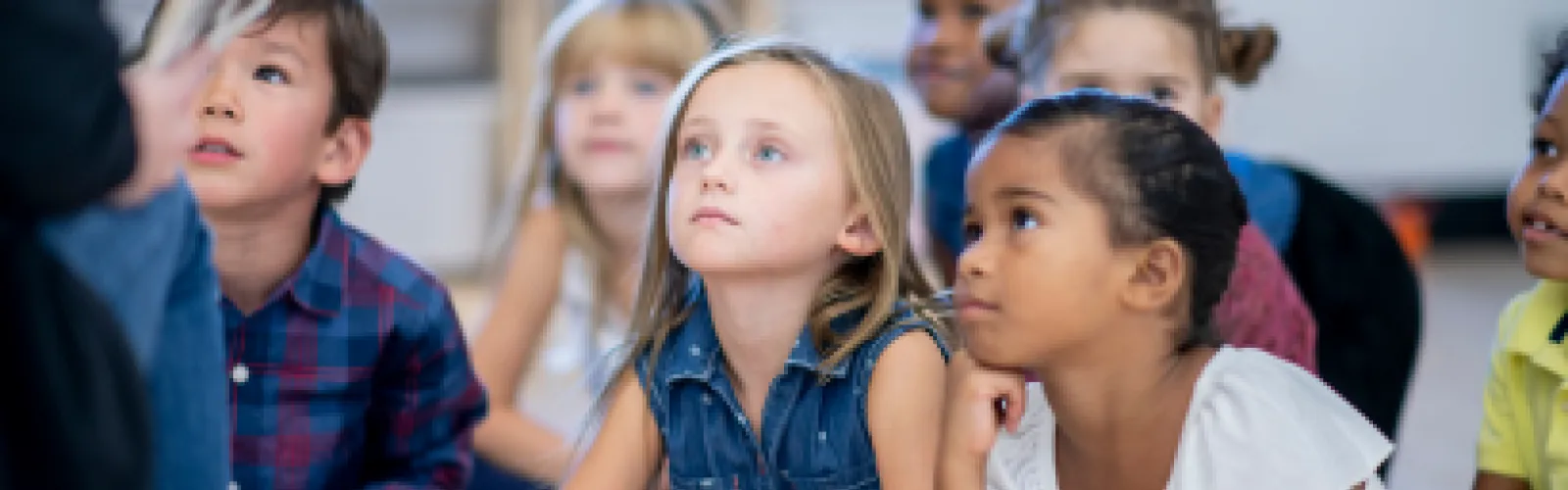 5 children listening to a story